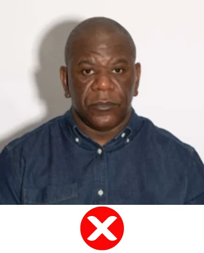 UK ETA Foto abgelehnt — Schatten hinter der Person